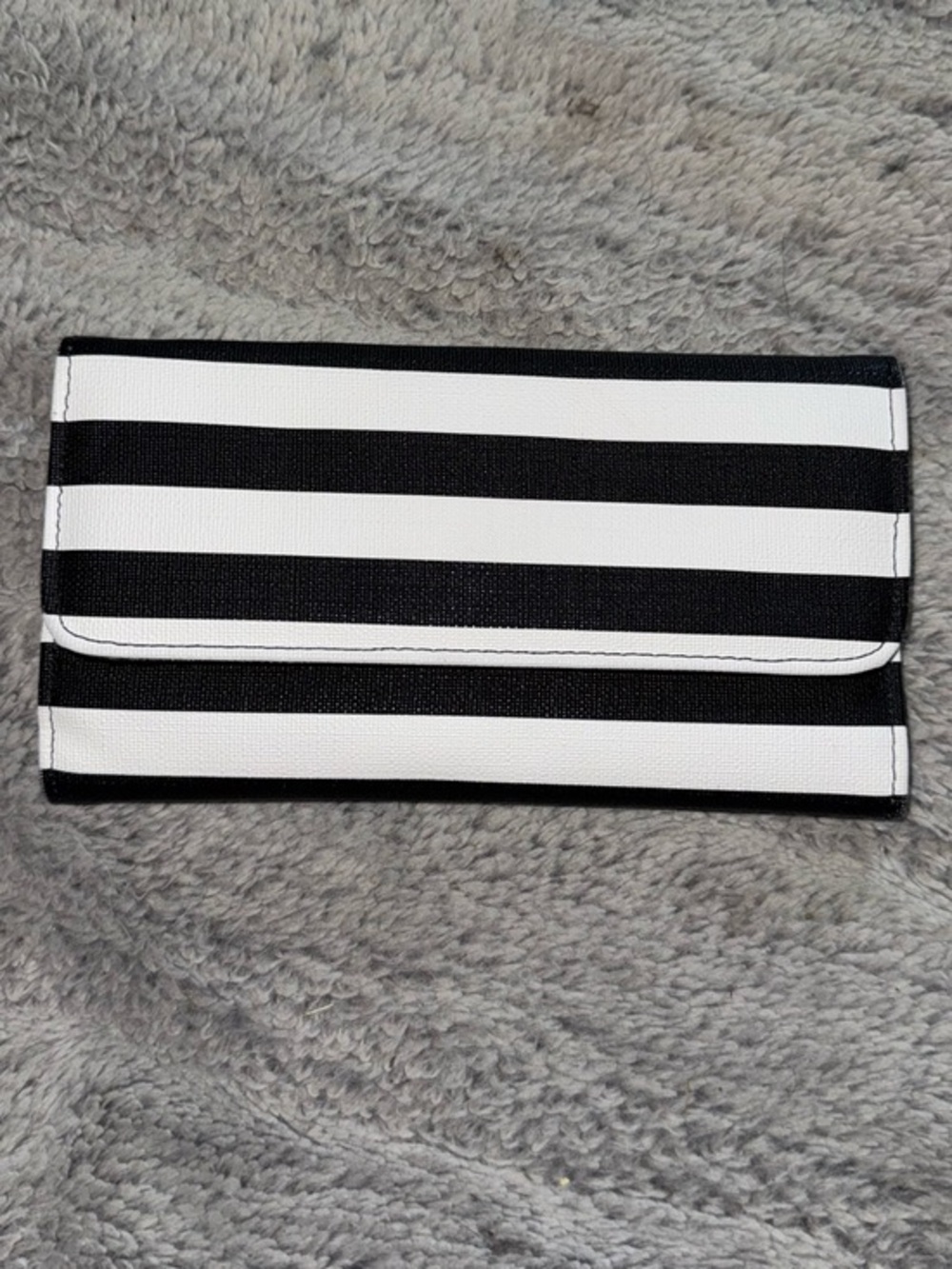 Kut from the Kloth slim striped wallet is made of black and white vegan leather